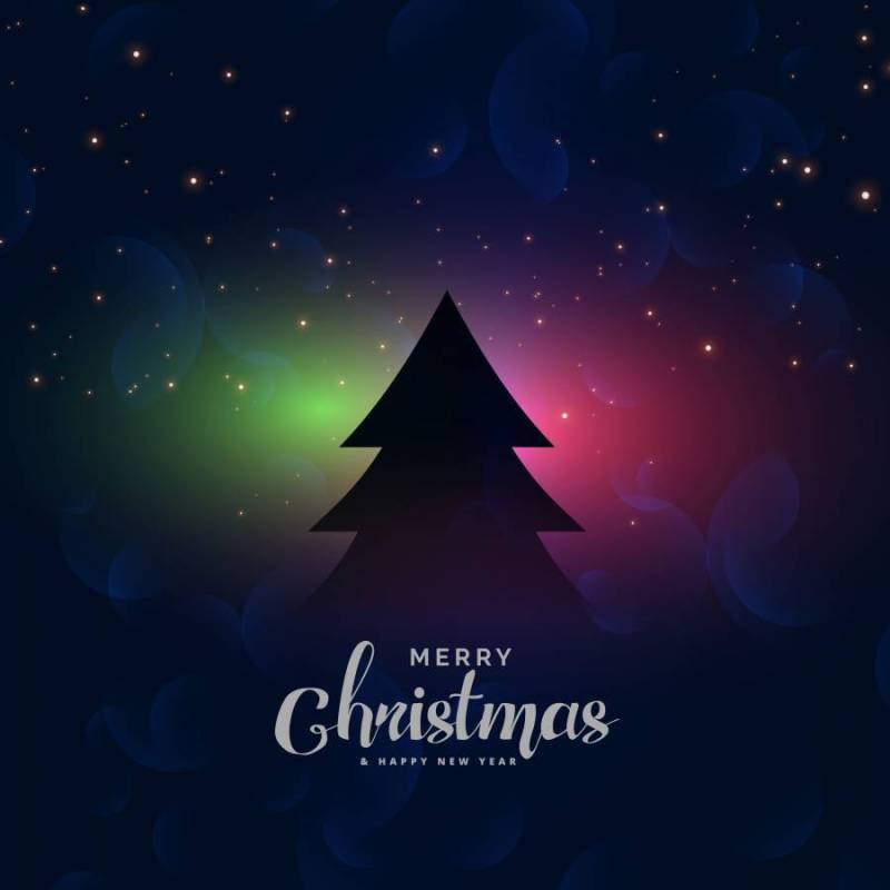 与圣诞树和光线影响的黑暗节日背景