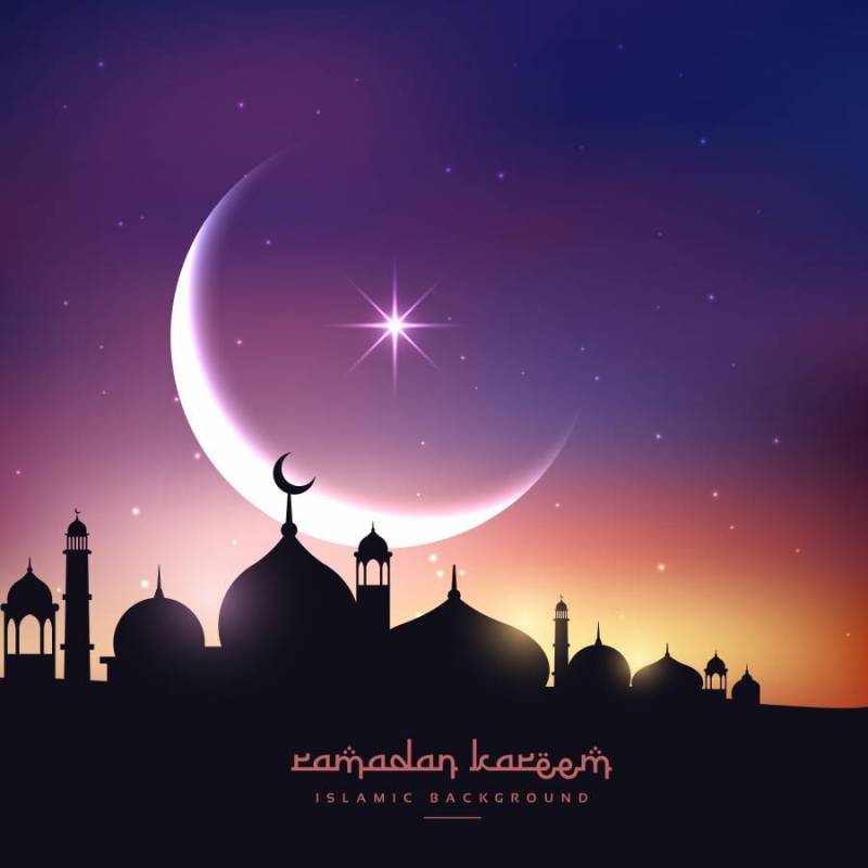 在与新月形月亮和星星的夜空中的清真寺剪影