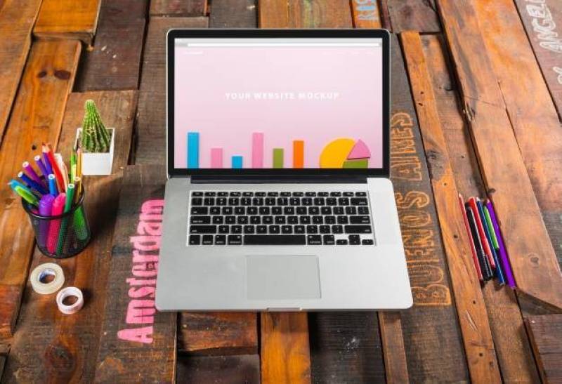 Laptop mockup on wooden table