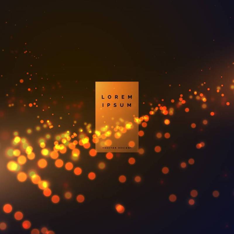 抽象散景粒子效果背景与温暖的颜色