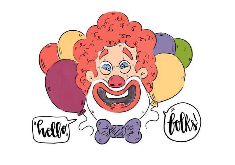 有红色蓬松卷发和气球的滑稽的微笑的小丑