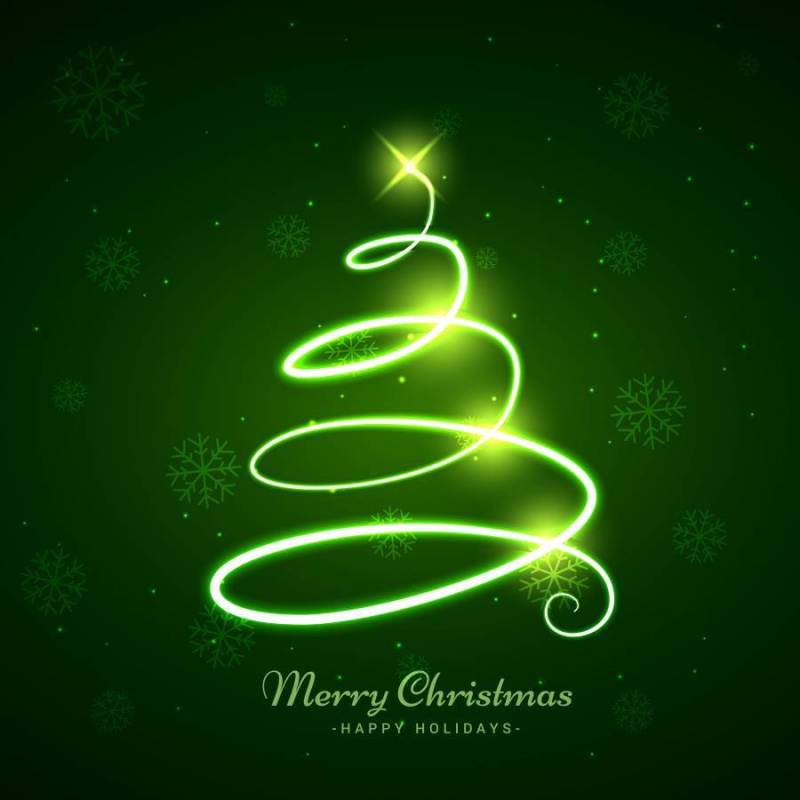 发光的圣诞树在绿色背景中
