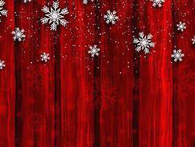 红色木背景上的圣诞雪花