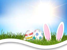 鸡蛋和兔子耳朵在草地上的复活节背景