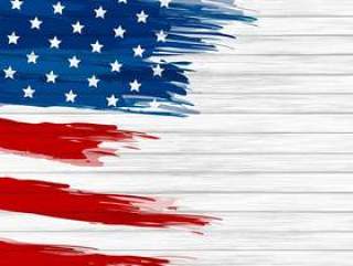 美国国旗油漆刷上白色的木背景